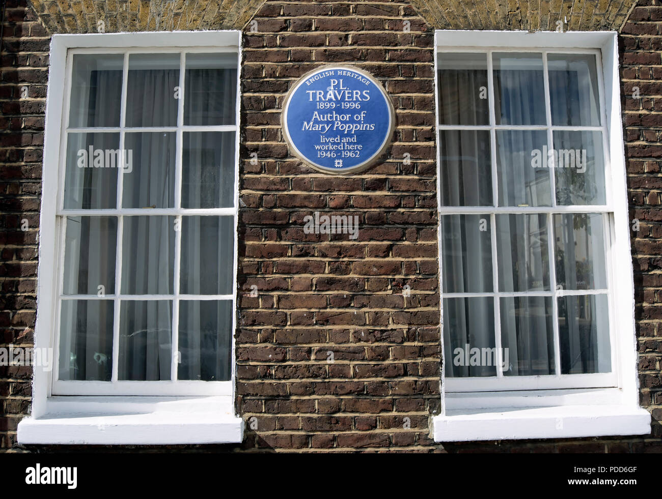 english heritage blue plaque marking a home of pl travers, author of