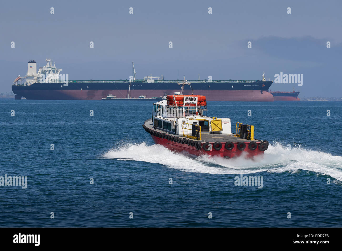 So Cal Ship Services Launch, MAKO, Underway In The Port Of Long Beach, The Giant Supertanker, ANTARES VOYAGER, Ahead, California, USA. Stock Photo