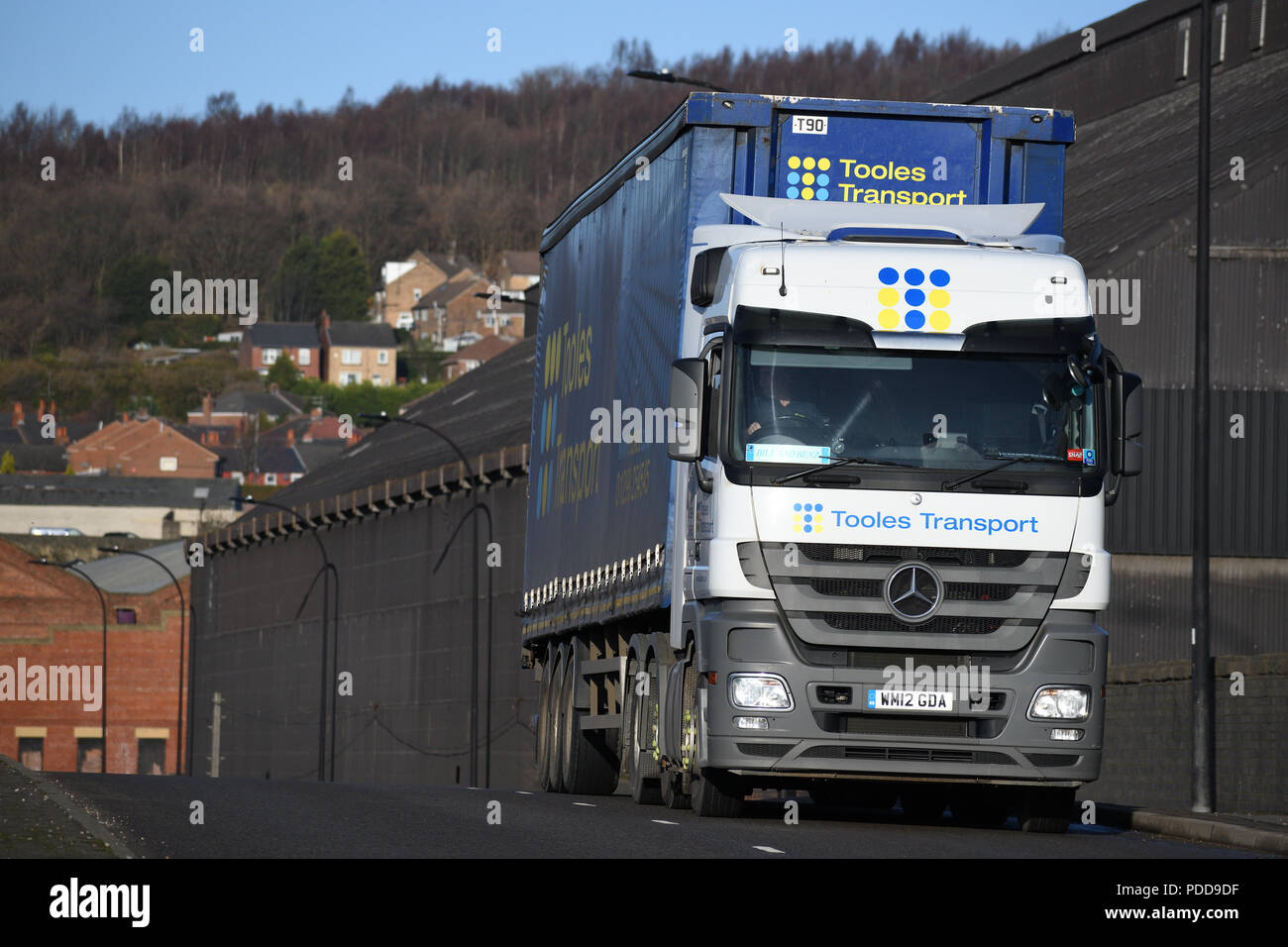 Mercedes-Benz Actros curtainsider truck passes Firth Brown steel works in Sheffield Stock Photo