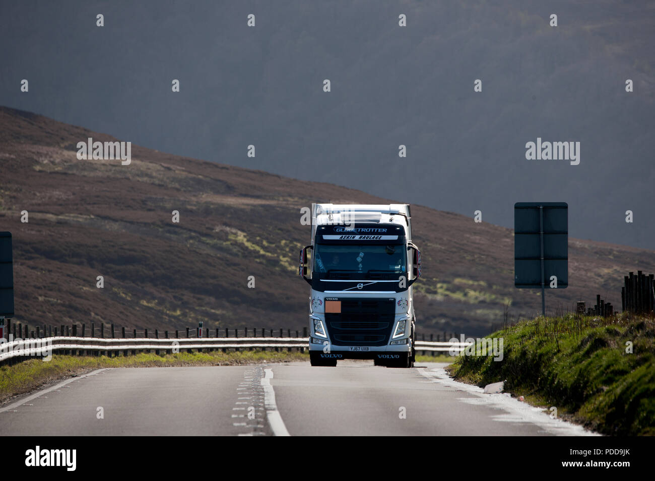 Volvo Globetrotter truck climbing a long incline on Woodhead Pass, Yorkshire Stock Photo