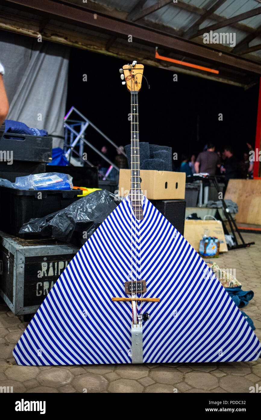 Giant russian bass babalaika on the stage with noone Stock Photo