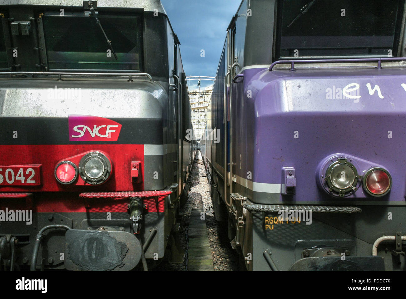 PARIS, FRANCE - AUGUST 19, 2006: Two trains ready for departure in Paris Gare de l'Est train station, with the logo of SNCF seen in front. This train  Stock Photo