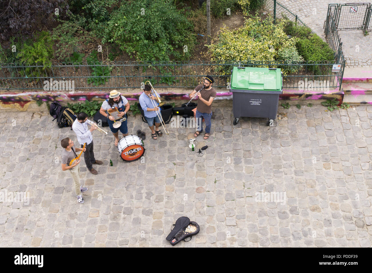 Street music band - Top view of street musicians playing under the Pont Neuf bridge in Paris, France, Europe. Stock Photo