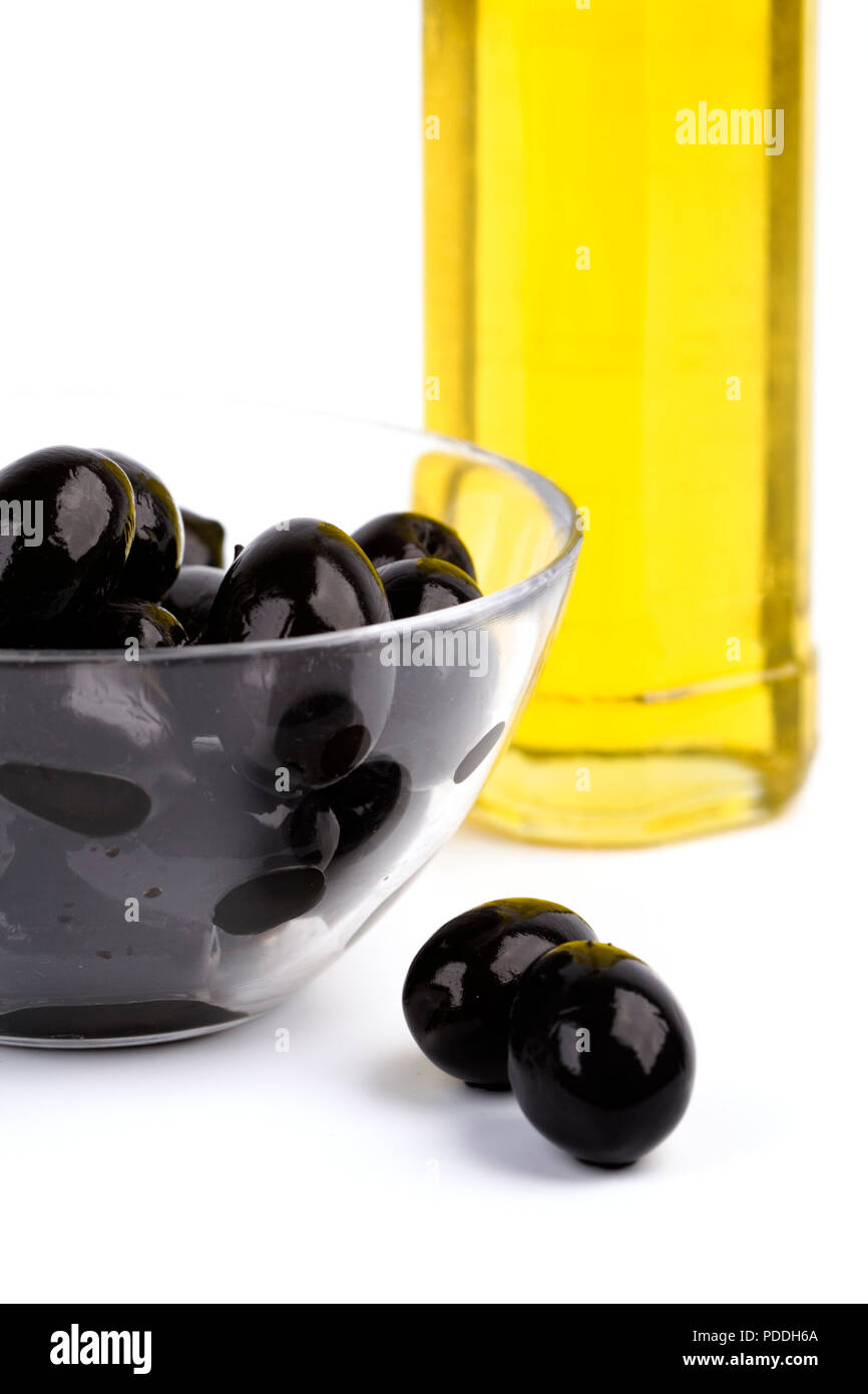 bowl of black olives and oil on white background Stock Photo Alamy