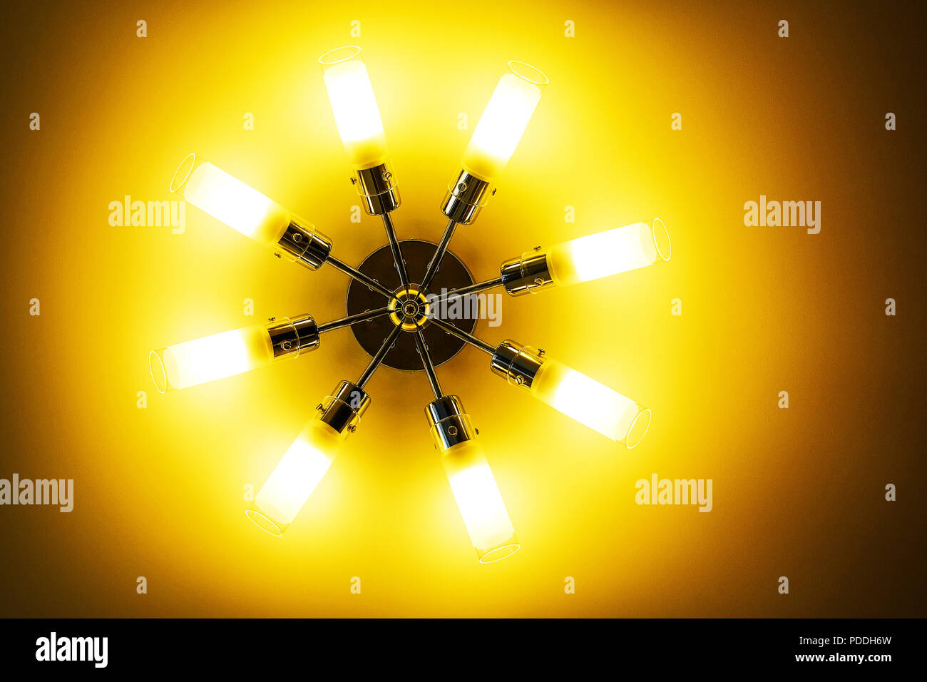 Ceiling light isolated on white background. Yellow spotlight Stock