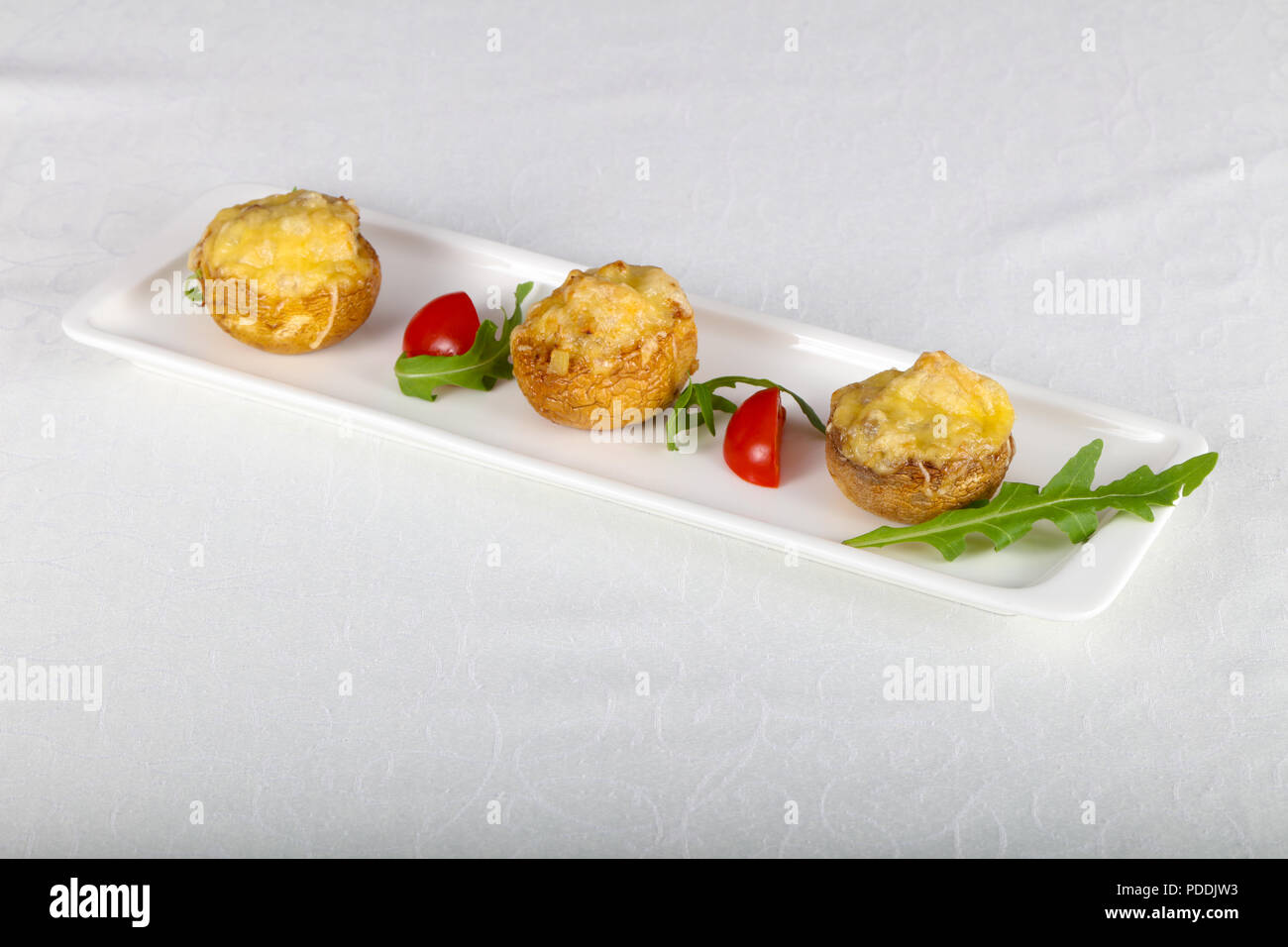 Baked mushrooms champignon with cheese Stock Photo - Alamy