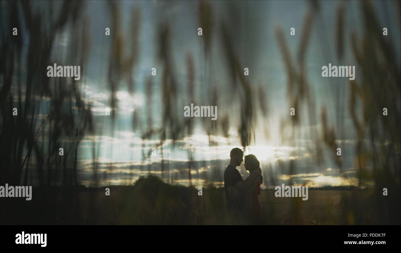 The girl runs to meet her boyfriend in a hug, against the backdrop of a  beautiful sunset by the river. HD, 1920x1080. slow motion Stock Photo -  Alamy
