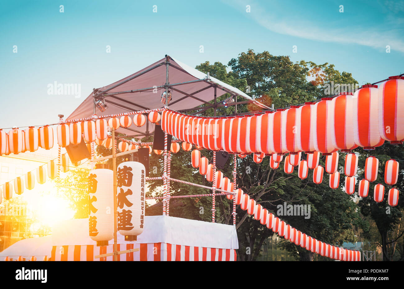 The stage of the Yaguro. Paper red-white lanterns Chochin Scenery for the holiday Obon when people dance of Bon Odori. Stock Photo