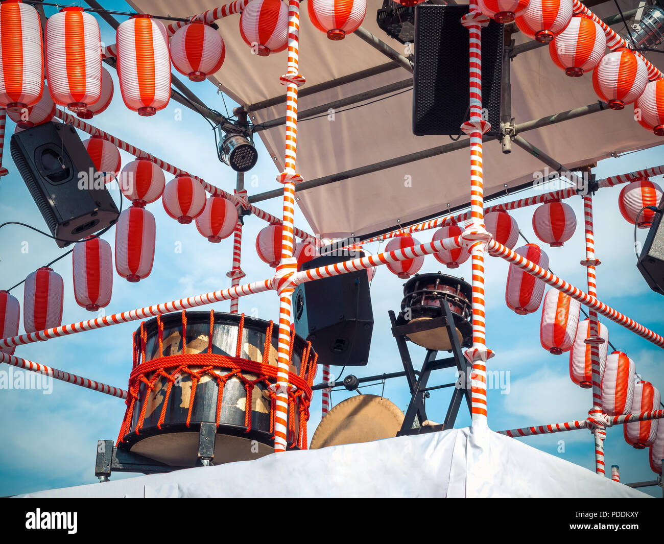 The stage of the Yaguro. Paper red-white lanterns Chochin Scenery for the holiday Obon when people dance of Bon Odori. Stock Photo