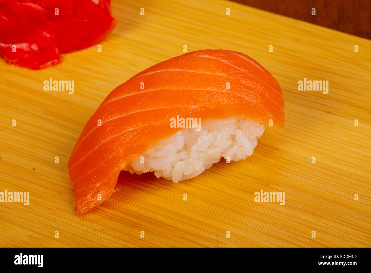 Japanese traditional Salmon sushi over wooden Stock Photo - Alamy