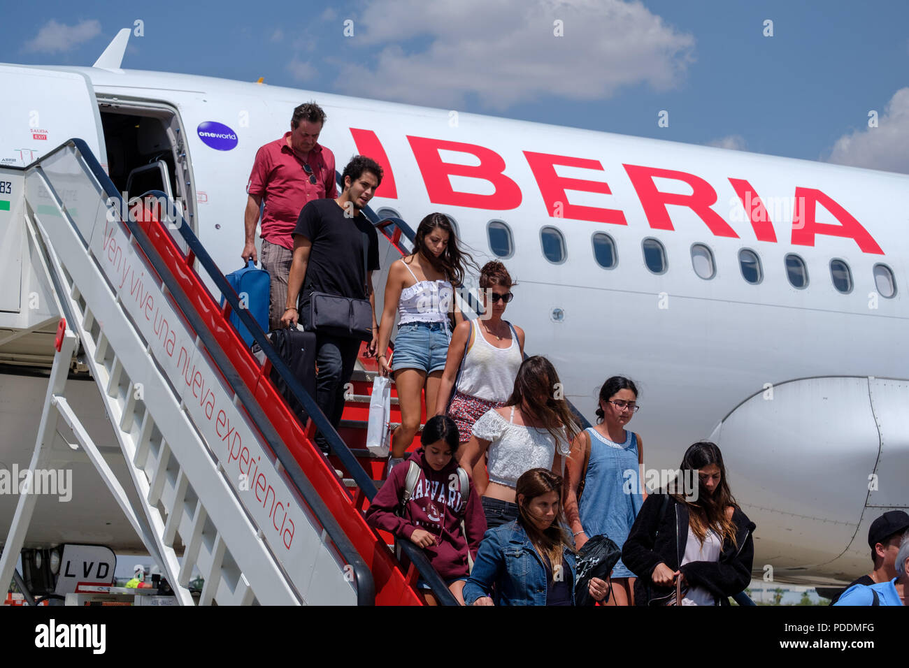 Passengers disembarking an Iberia airplane Stock Photo