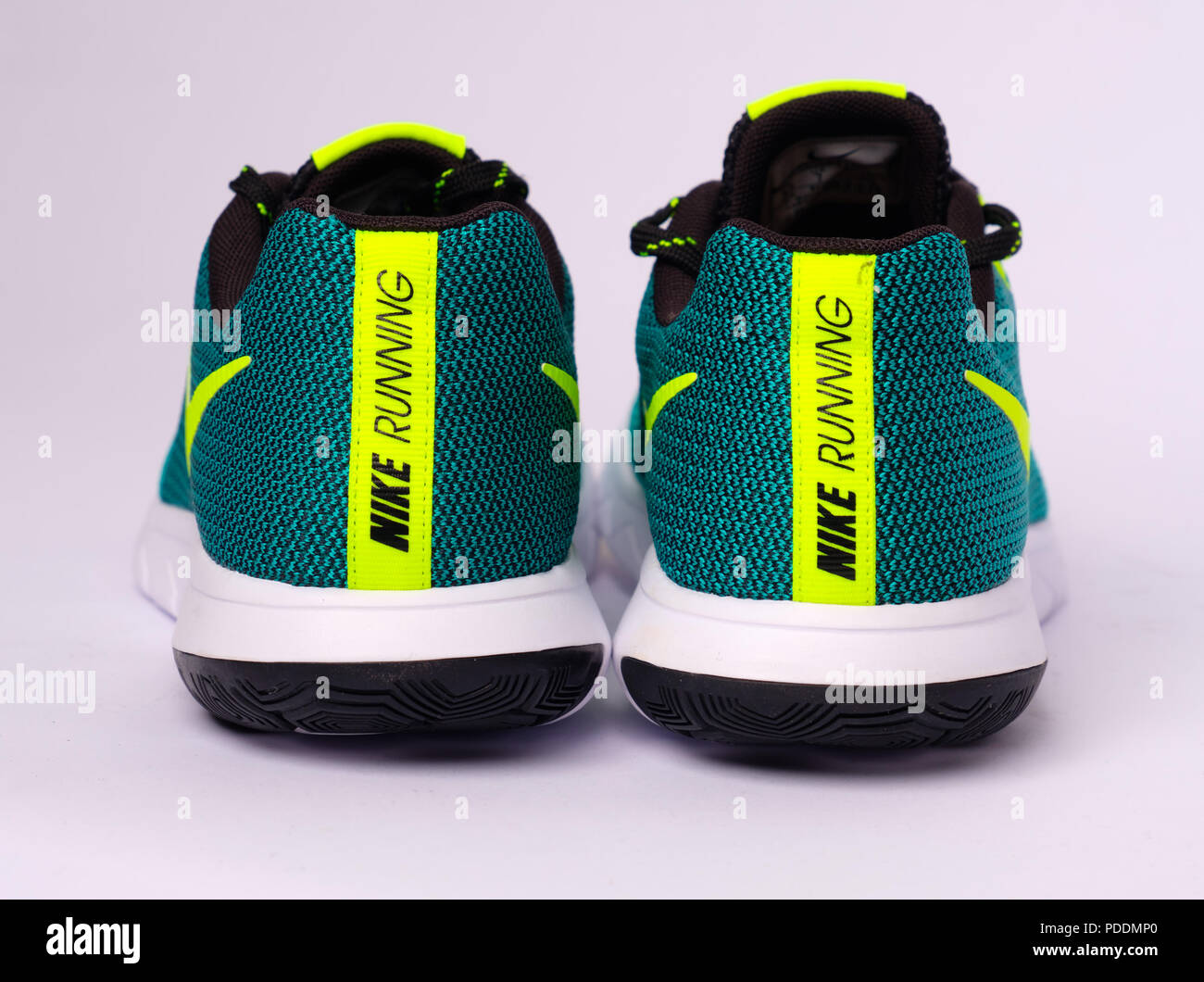Educación escolar Caracterizar grua Pair of green Nike Flex Experience RN 5 running shoes cut out isolated on  white background Stock Photo - Alamy