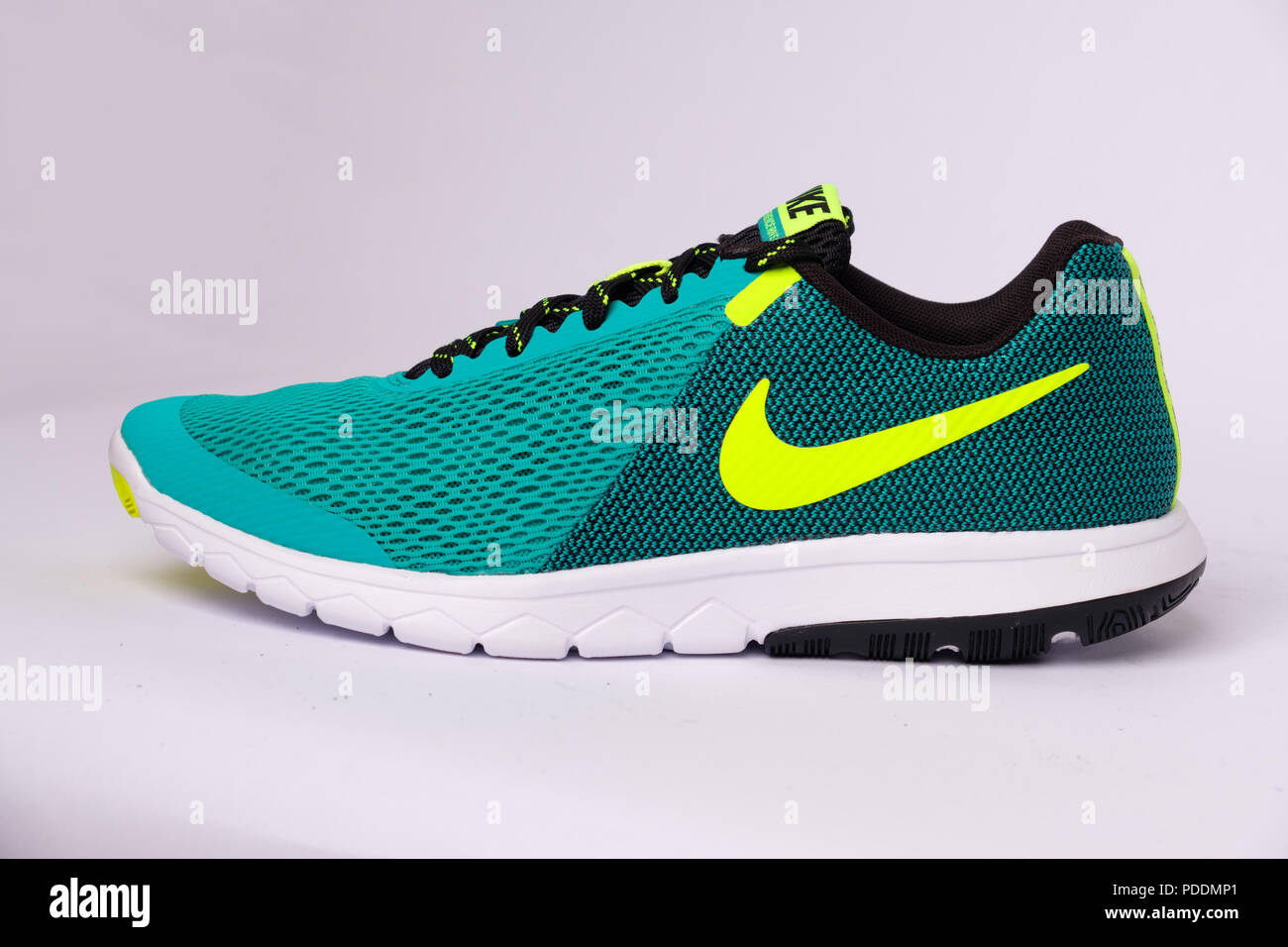 Green Nike Flex Experience RN 5 running shoe cut out isolated on white background Stock Photo