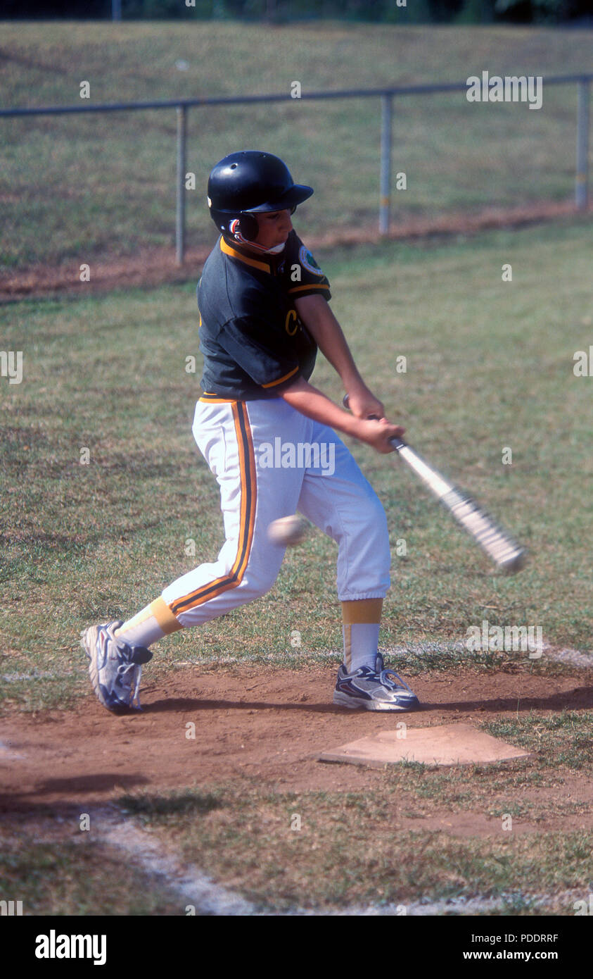 A YOUNG TEENAGE BOY STANDING AT THE PLATE ABOUT TO BAT AT A JUNIOR BASEBALL GAME IN SYDNEY, NEW SOUTH WALES, AUSTRALIA Stock Photo