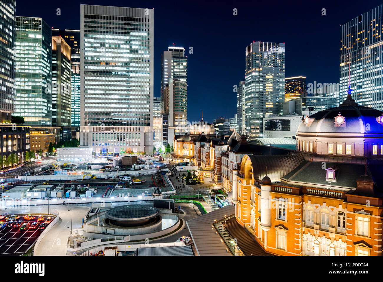 Business concept for real estate and corporate construction - panoramic modern city skyline bird eye aerial night view with tokyo station under dramat Stock Photo