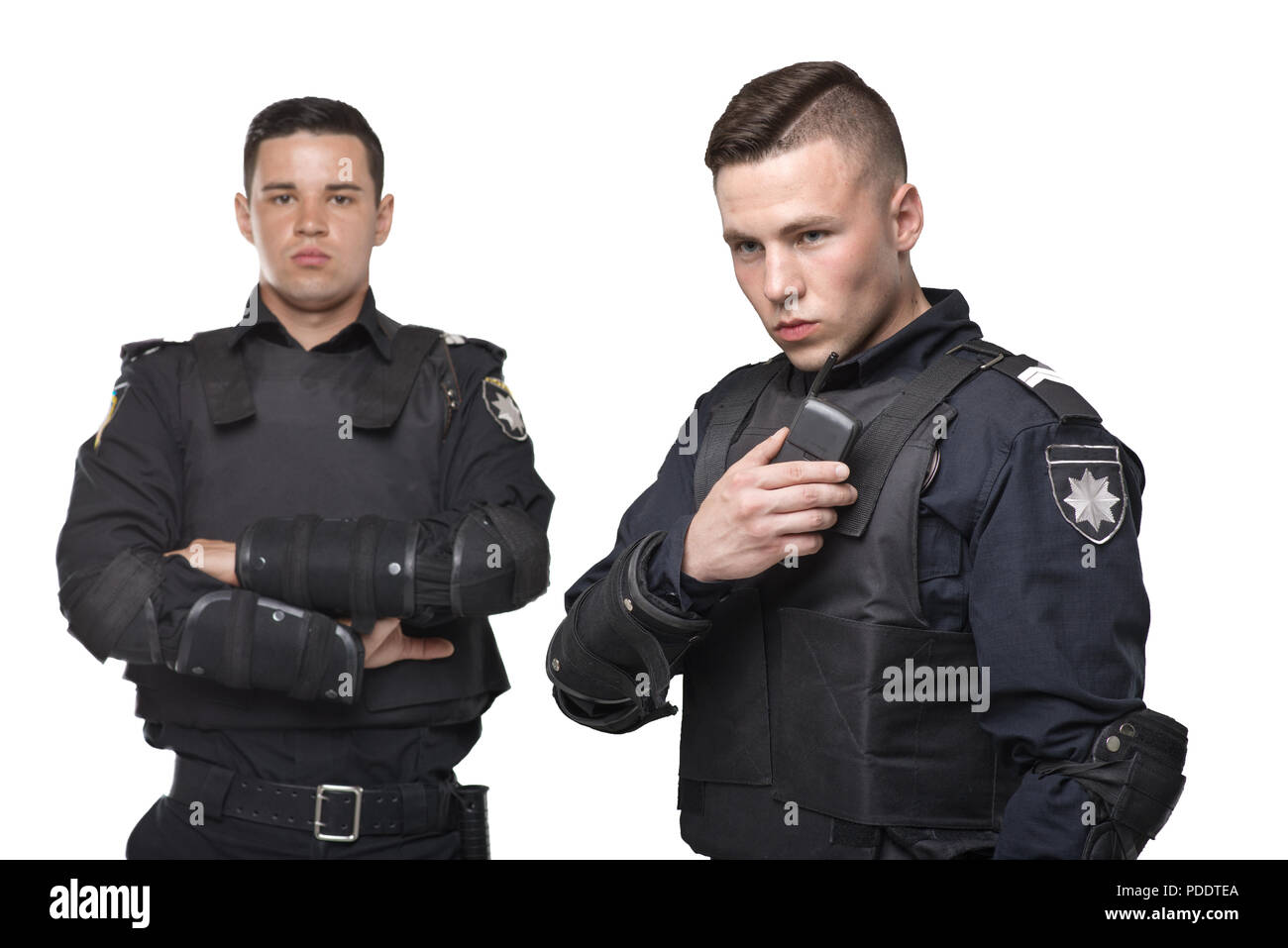 Cops in uniform and body armor on white background Stock Photo