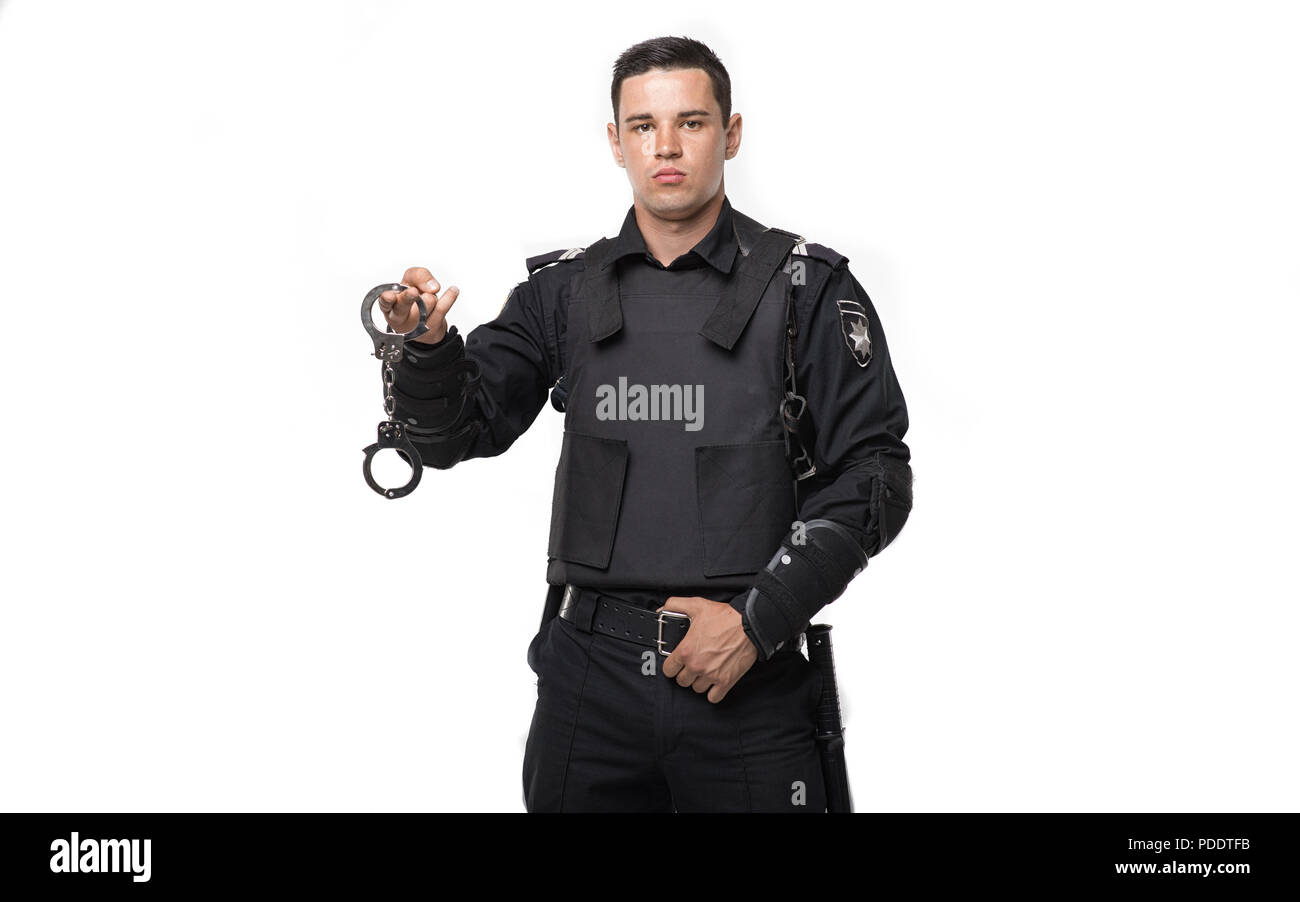 Special force soldier holds handcuffs Stock Photo