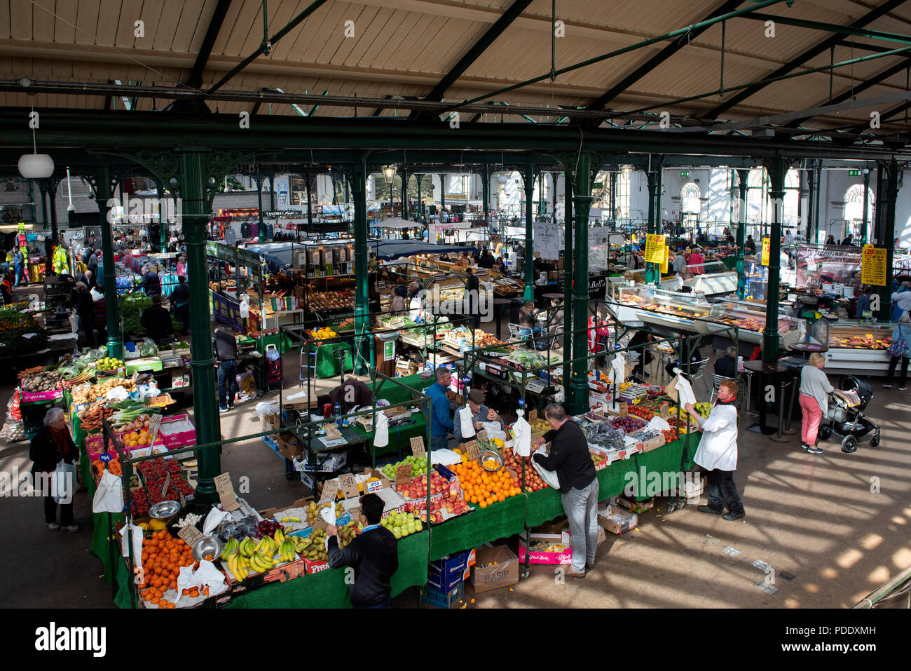 View over stalls inside a city centre market Stock Photo