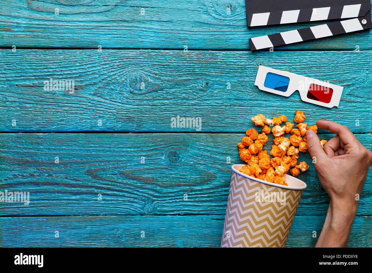 People eating popcorn. Human hands. Top view Stock Photo Alamy