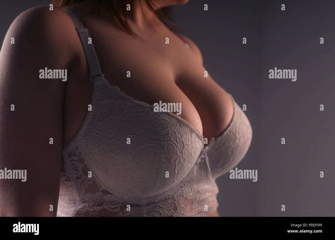 Sexy girl with large breasts posing Stock Photo - Alamy