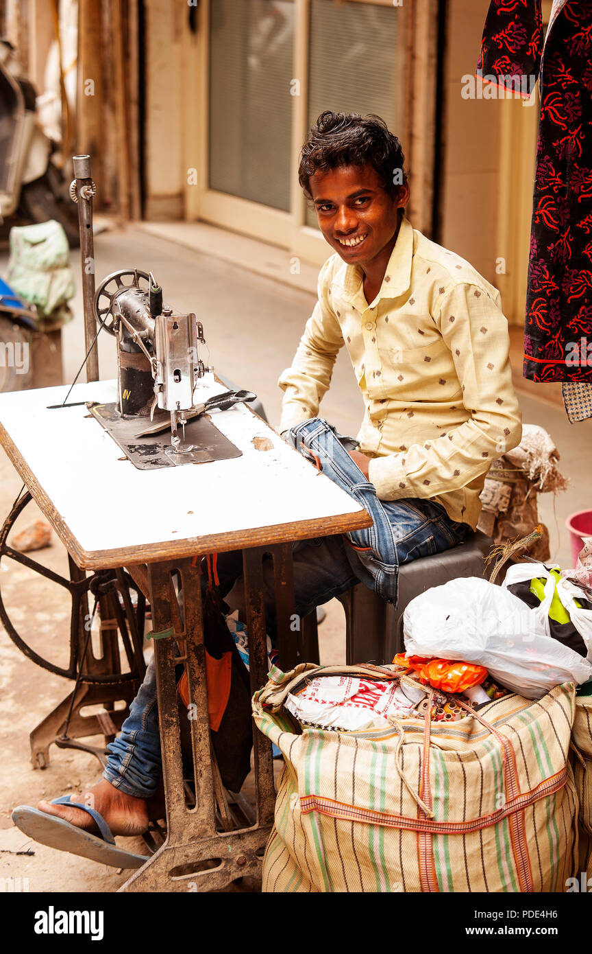 Young indian boy working on Sangatrashan Bazar, Paharganj, New Delhi, India Stock Photo