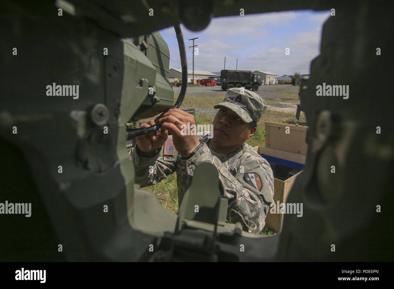 New Jersey Army National Guard Staff Sgt. Johnny Soriano looks over a