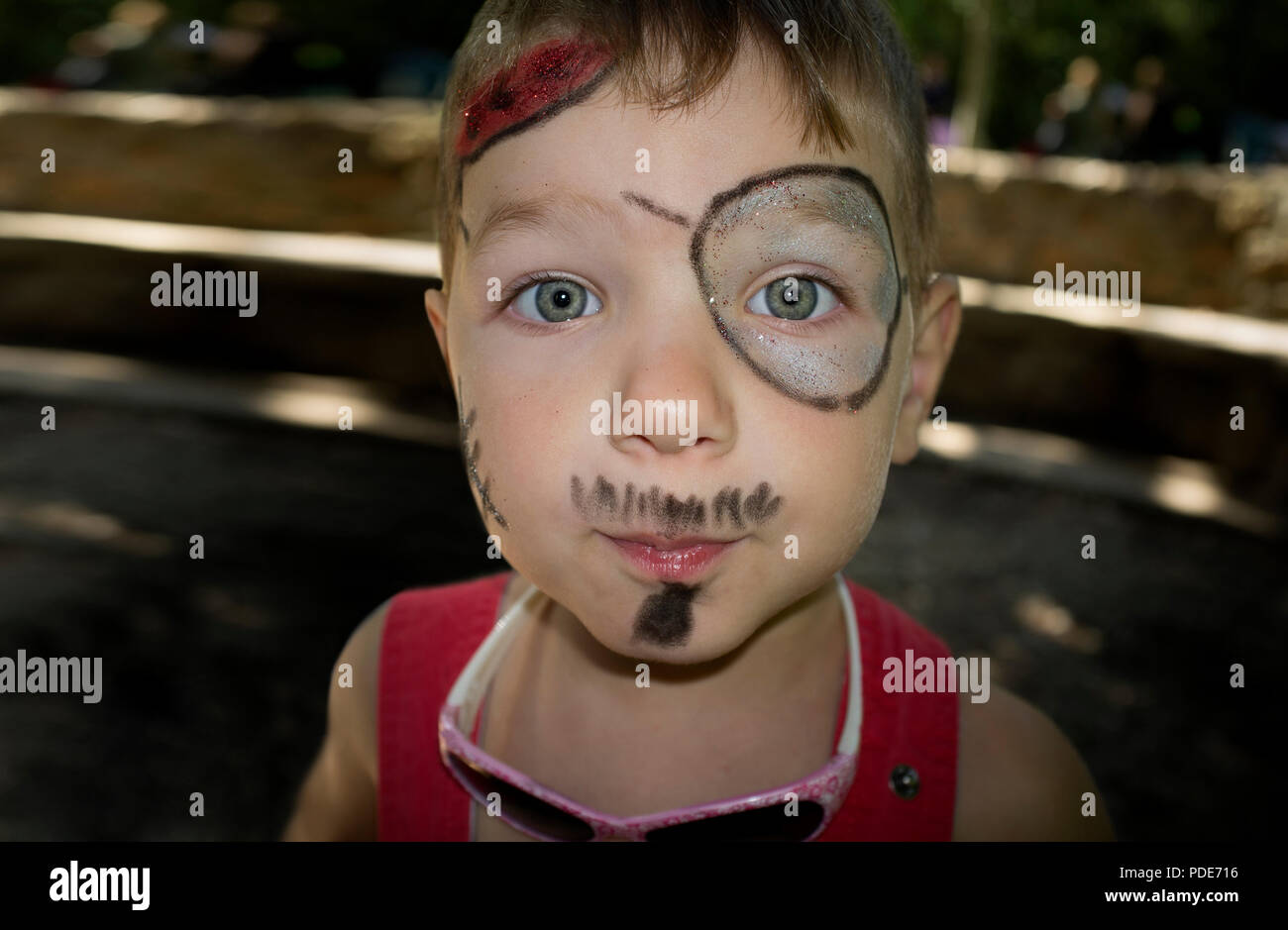 Little boy with face painted during outdoors party. Portrait Stock Photo