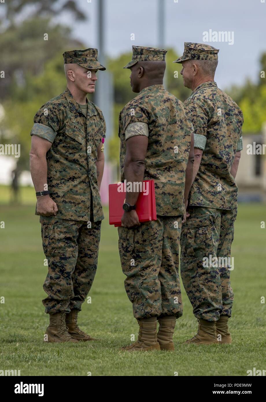 Lt. Gen. Lewis Craparotta, the I Marine Expeditionary Force commanding general, right, awards Sgt. Maj. Bradley Kasal, left, the outgoing I MEF sergeant major, the Legion of Merit during a relief and appointment ceremony on Camp Pendleton, Calif., May 18, 2018. Sgt. Maj. James Porterfield replaced Kasal as I MEF sergeant major. Kasal has served as I MEF sergeant major since 2015 and is retiring from the Marine Corps after 34 years of service. Stock Photo