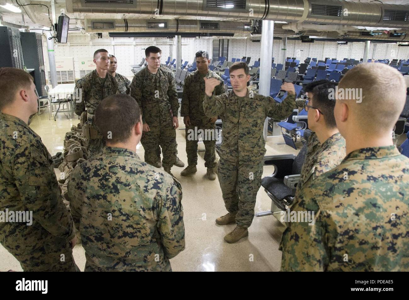 USNS MILLINOCKET, At Sea (May 20, 2018) Members of the Fleet Anti-Terrorism Security Team Pacific (FASTPAC) Marines debrief after conducting a reaction drill aboard USNS Millinocket (T-EPF 3) during a U.S. 7th Fleet theater security cooperation patrol. FASTPAC is providing security for Millinocket during her visit to several countries in the Indo-Pacific in the coming weeks. Stock Photo