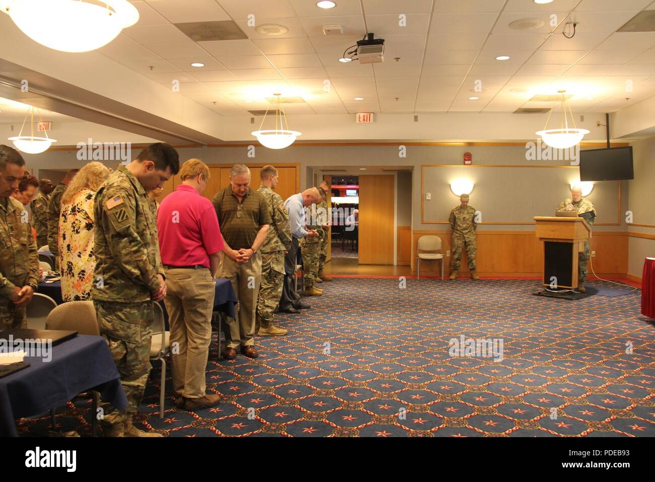 Chaplain (Lt. Col.) Leach (right) gives the invocation at the Asian ...