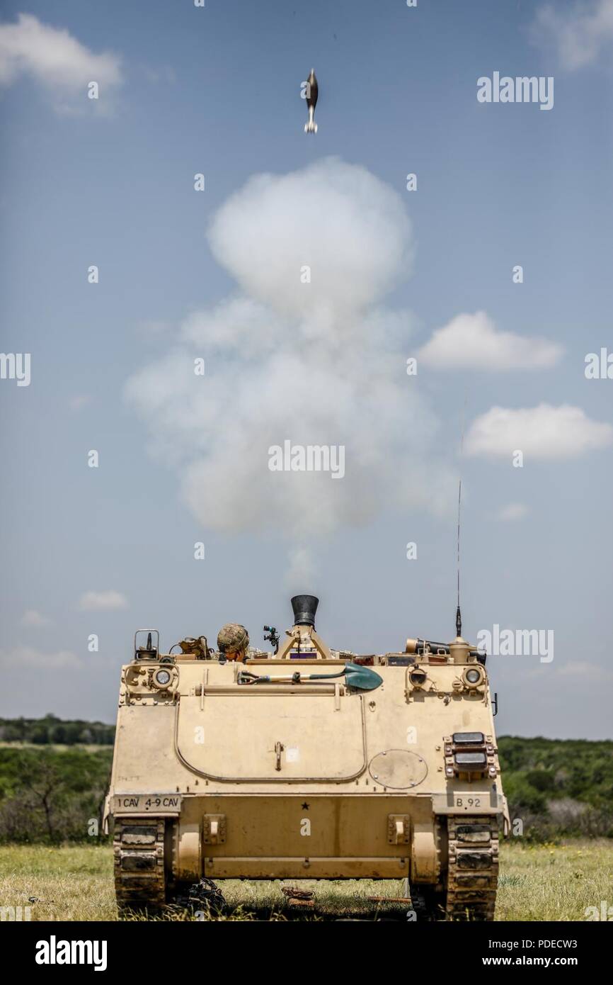 Spc. Tyler Hughes and Pfc. David West, Apache 9-1 crew, 4-9 Cav, 2ABCT fire a high explosive (HE) round from their M1064A3 during the brigade's Mortar Training and Evaluation Program (MORTEP) at Curry Mortar Center, Fort Hood May 15. The MORTEP is a bi-annual certification program for a mortar troop on organic indirect fire systems. Stock Photo