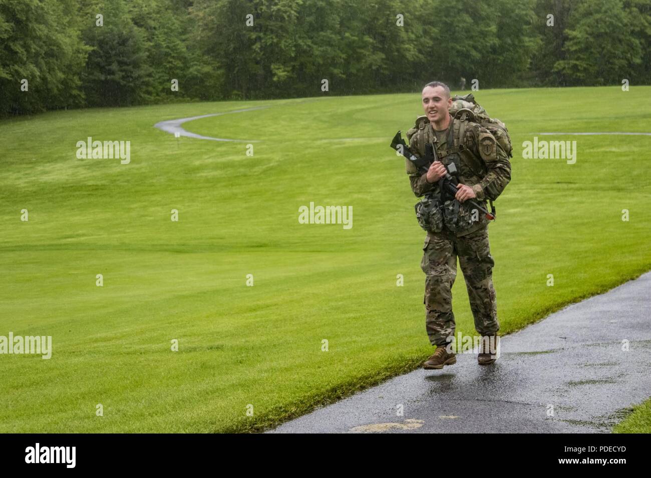 U.S. Army Spc. Nicholas Rossetti, a musician assigned to the 39th Army Band, New Hampshire Army National Guard, completes the 12-mile ruck march portion of the Region 1 Best Warrior Competition at West Point, N.Y., May 19, 2018. The Region 1 Best Warrior Competition, held May 16-19, 2018, is an annual event in which junior enlisted Soldiers and noncommissioned officers (NCOs) from eight Northeastern states compete in several events intended to test their military skills and knowledge, as well as their physical fitness and endurance. The two winners (one junior enlisted and one NCO) will go on  Stock Photo