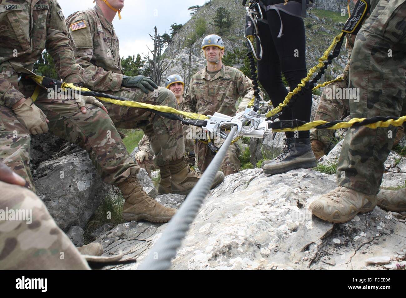 Maj. Isaac S. Howard, executive officer for the 3-61 CAV, listens to the troops expressing their view of rock climbing in Kosovo on May 19. Stock Photo