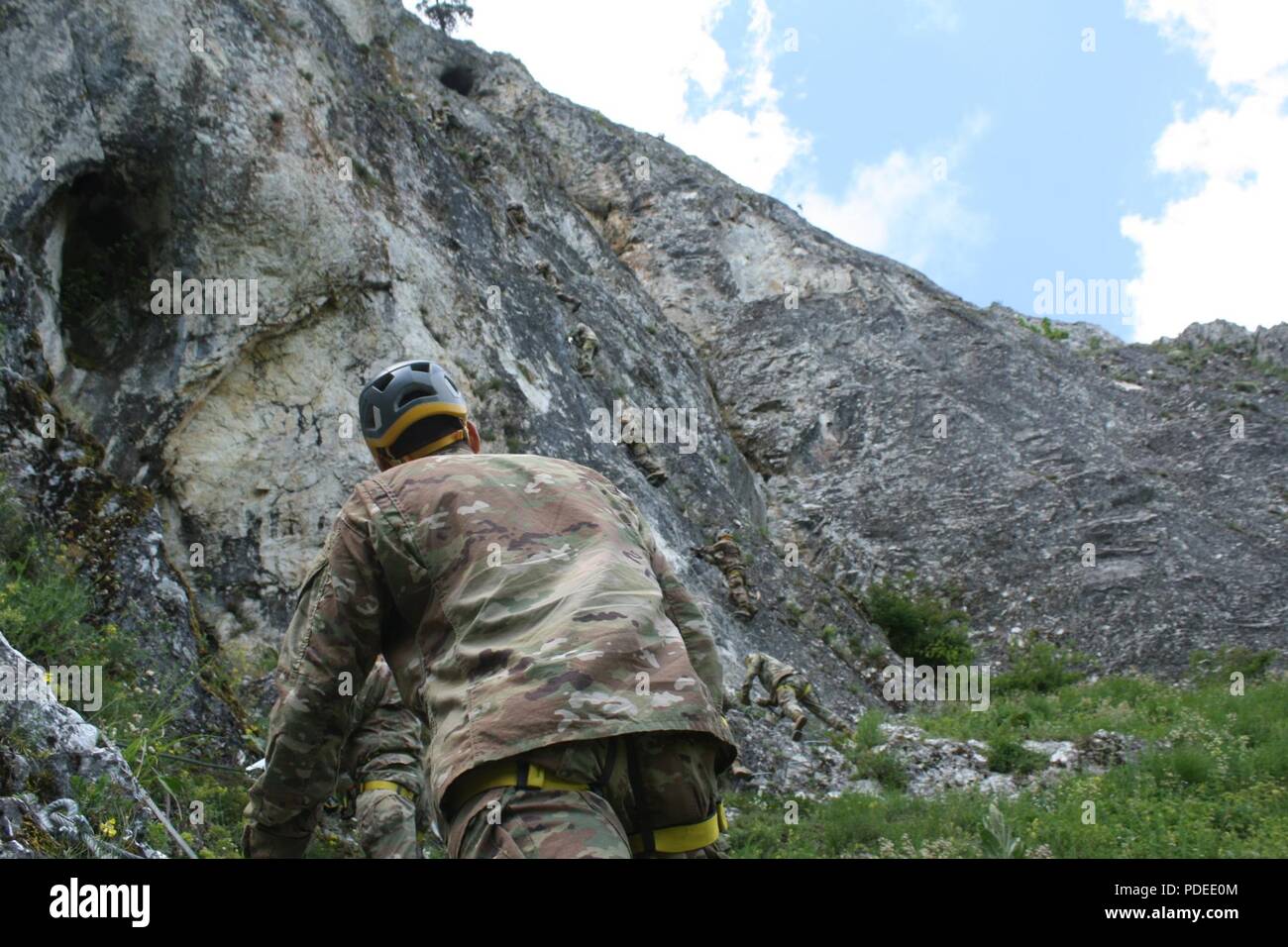 Soldiers from the 3-61 CAV climb Via Ferrata Berim mountain May 19 in Kosovo. Stock Photo