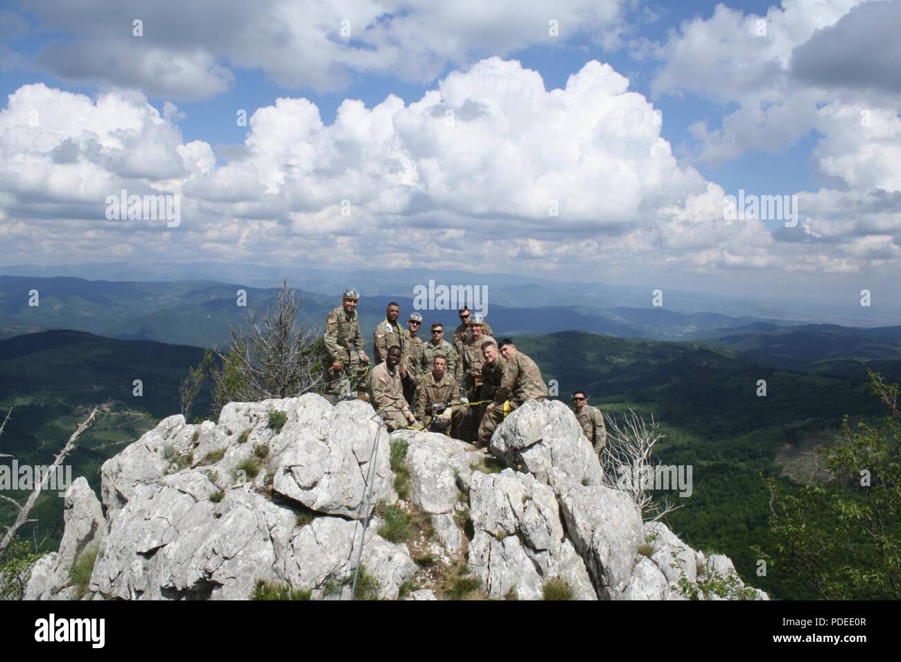 Soldiers from the 3-61 CAV take in the view atop Via Ferrata Berim mountain May 19 in Kosovo. Stock Photo