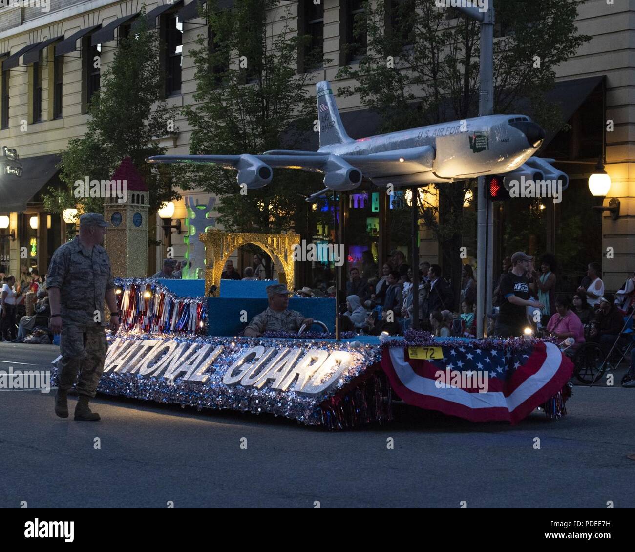 Guardsmen from the 141st Air Refueling Wing walk alongside the Air