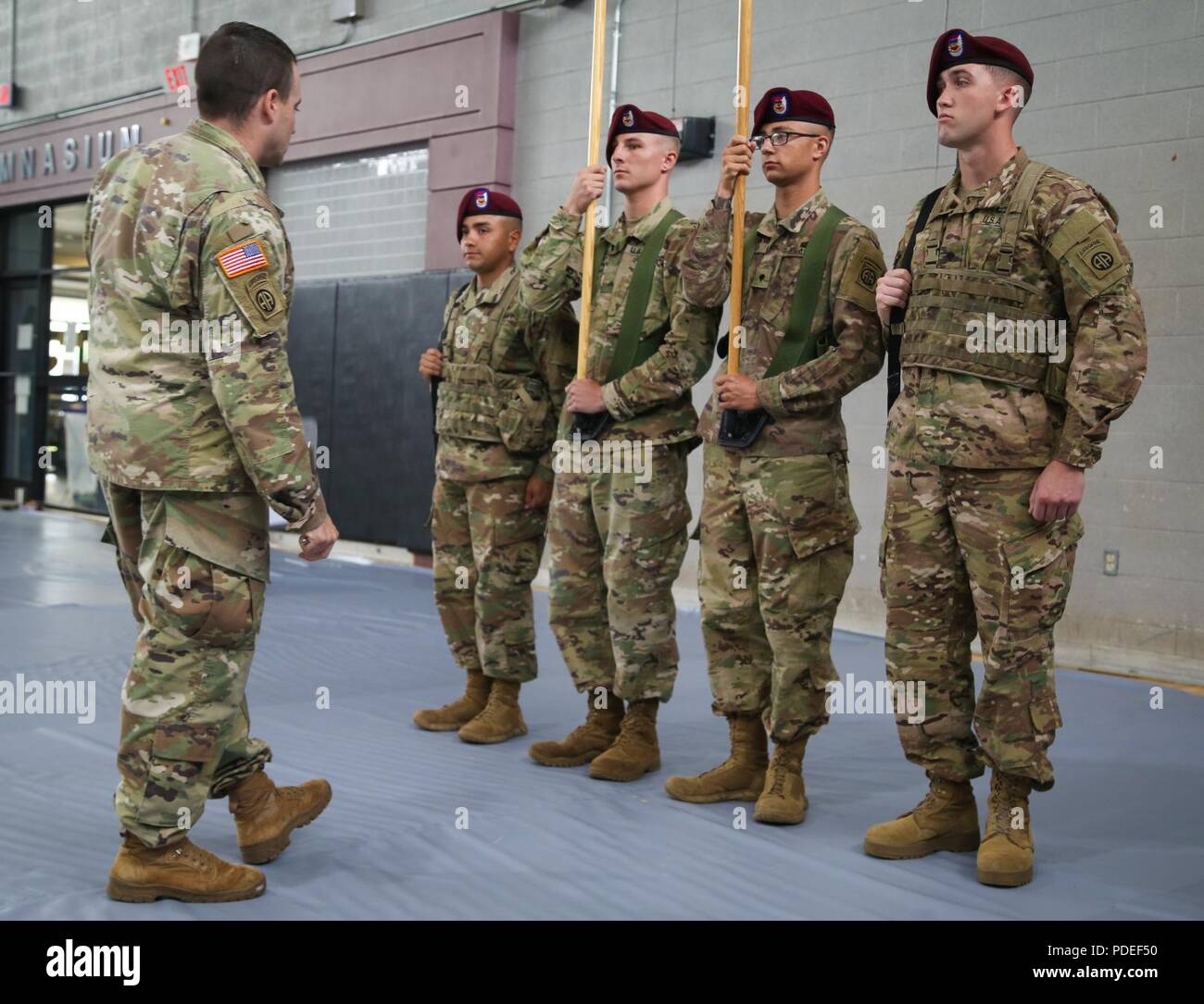 U.S. Paratroopers of the 3rd Battalion, 73rd Cavalry Regiment, 82nd Airborne Division, recieve a briefing before the start of the Color Guard Competition on Fort Bragg, N.C., May 18, 2018. The competiton is held to see who will earn the chance to perform as color guard during the events of the All american Week celebration. Stock Photo