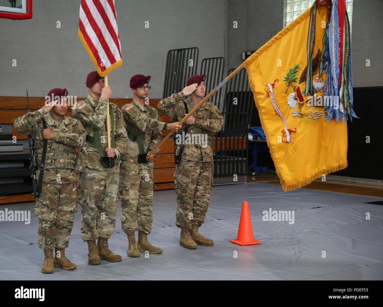 U.S. Paratroopers of the 3rd Battalion, 73rd Cavalry Regiment, 82nd Airborne Division, present arms during the Color Guard Competition on Fort Bragg, N.C., May 18, 2018. The competiton is held to see who will earn the chance to perform as color guard during the events of the All american Week celebration. Stock Photo