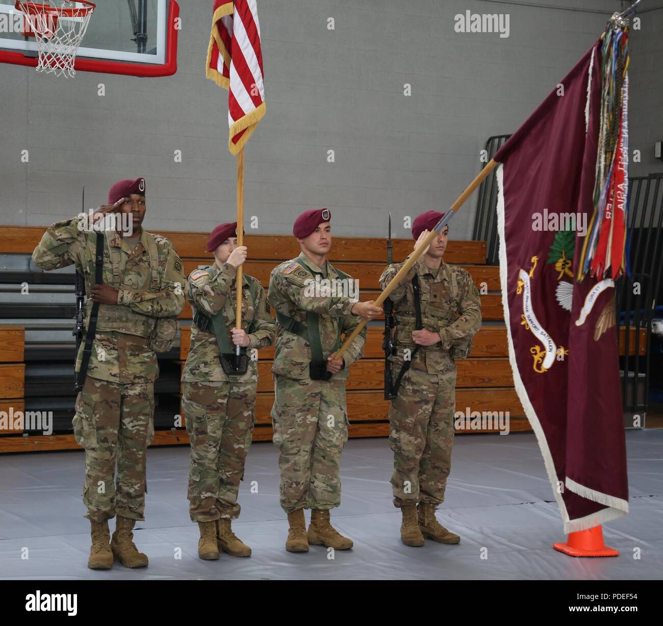 U.S. Paratroopers of the 307th Brigade Support Battalion, 82nd Airborne Division, present arms during the Color Guard Competition on Fort Bragg, N.C., May 18, 2018. The competiton is held to see who will earn the chance to perform as color guard during the events of the All american Week celebration. Stock Photo