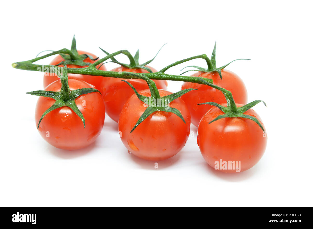 Red cherry tomato isolated on white background Stock Photo - Alamy