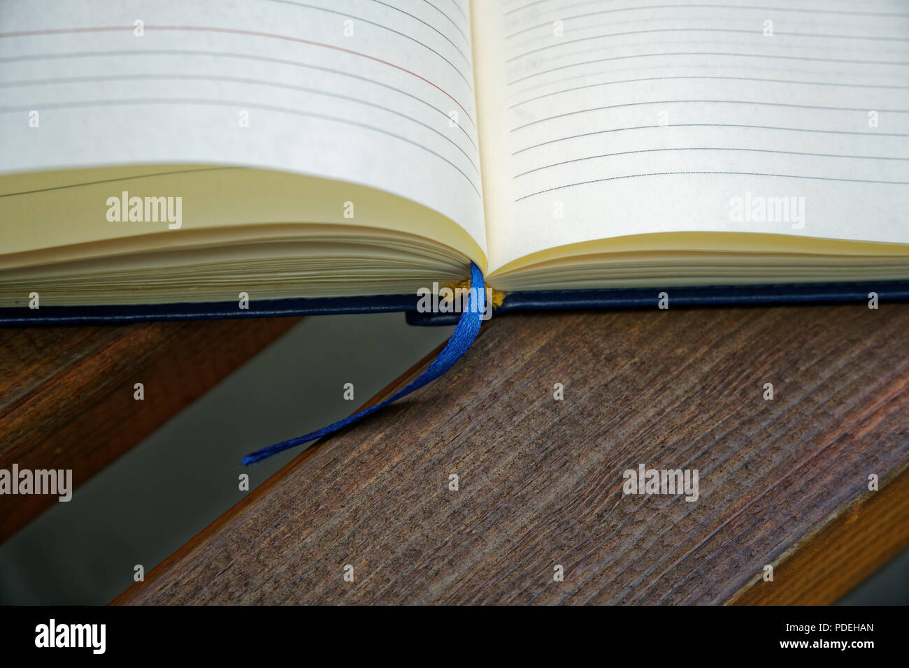 Open Notebook lies bench in park, business concept Stock Photo - Alamy