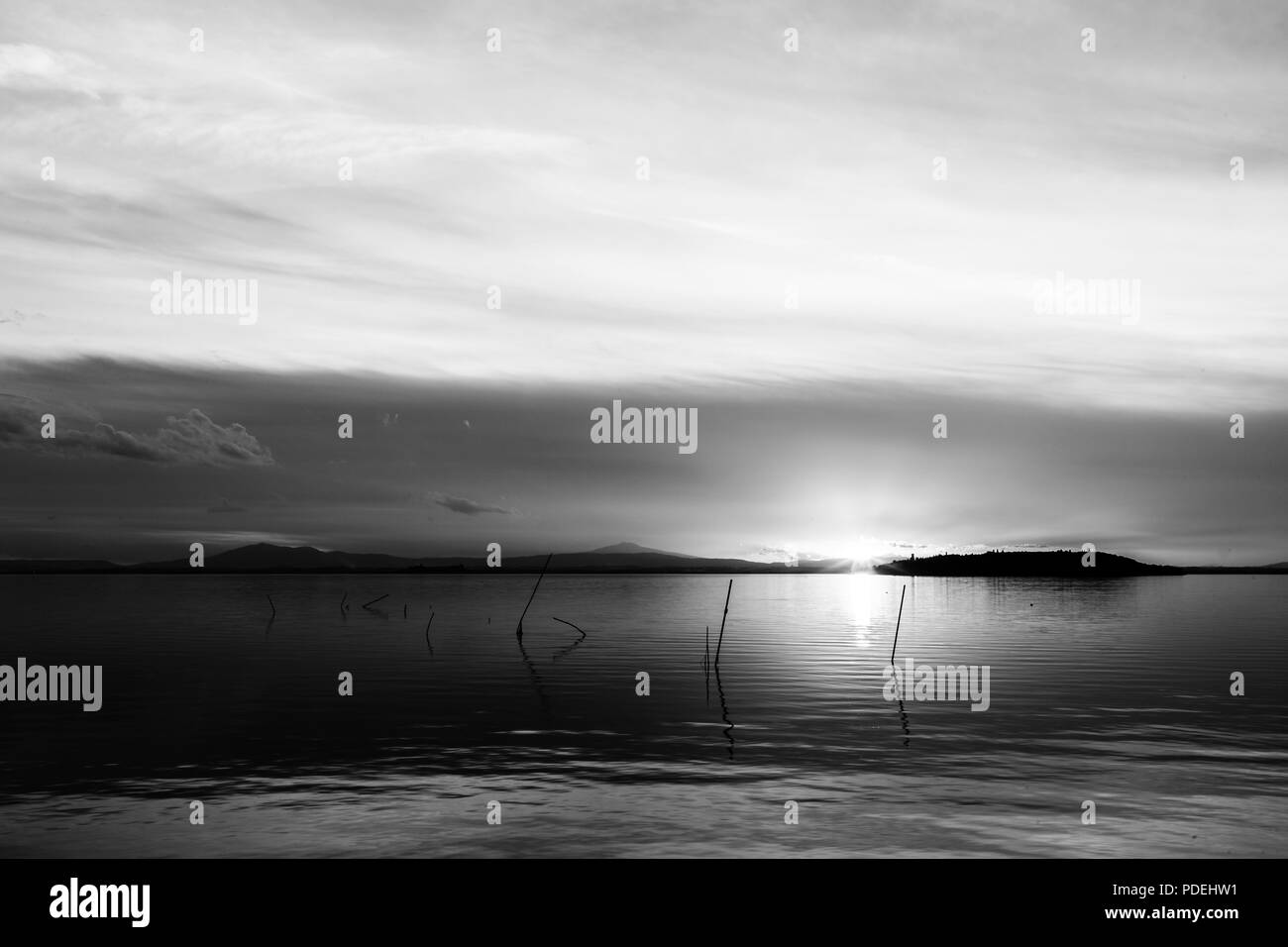 Sunset behind island Black and White Stock Photos & Images - Alamy