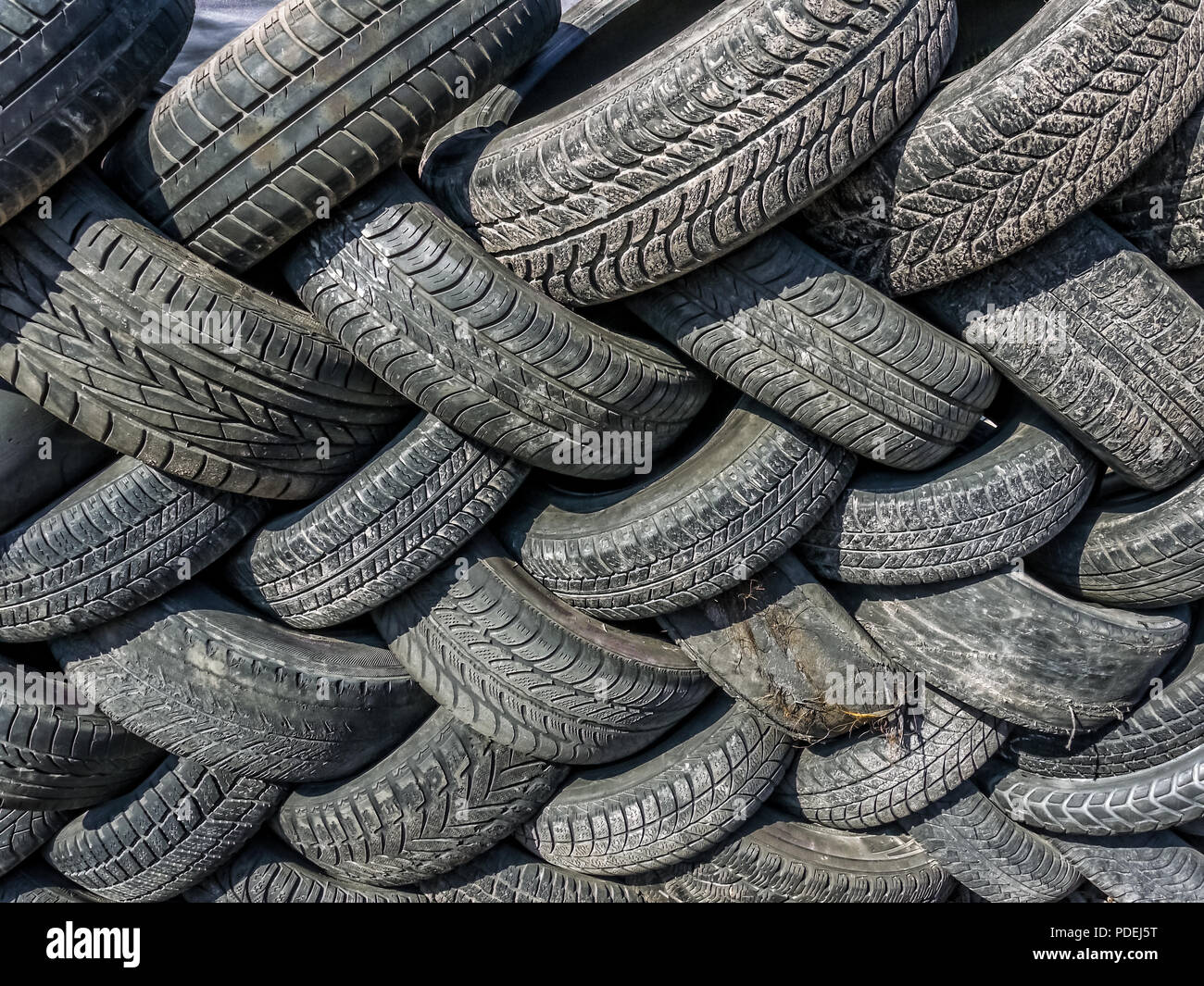 Piles of used and worn car tires Stock Photo