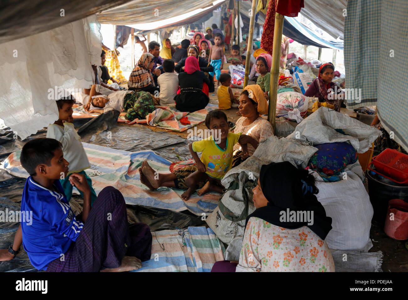 Newly arrived Rohingya refugees in their shelter at Kutupalong, Cox's Bazar, Bangladesh Stock Photo