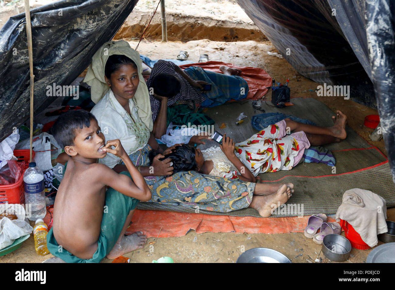 Newly arrived Rohingya refugees in their shelter at Kutupalong, Cox's Bazar, Bangladesh Stock Photo