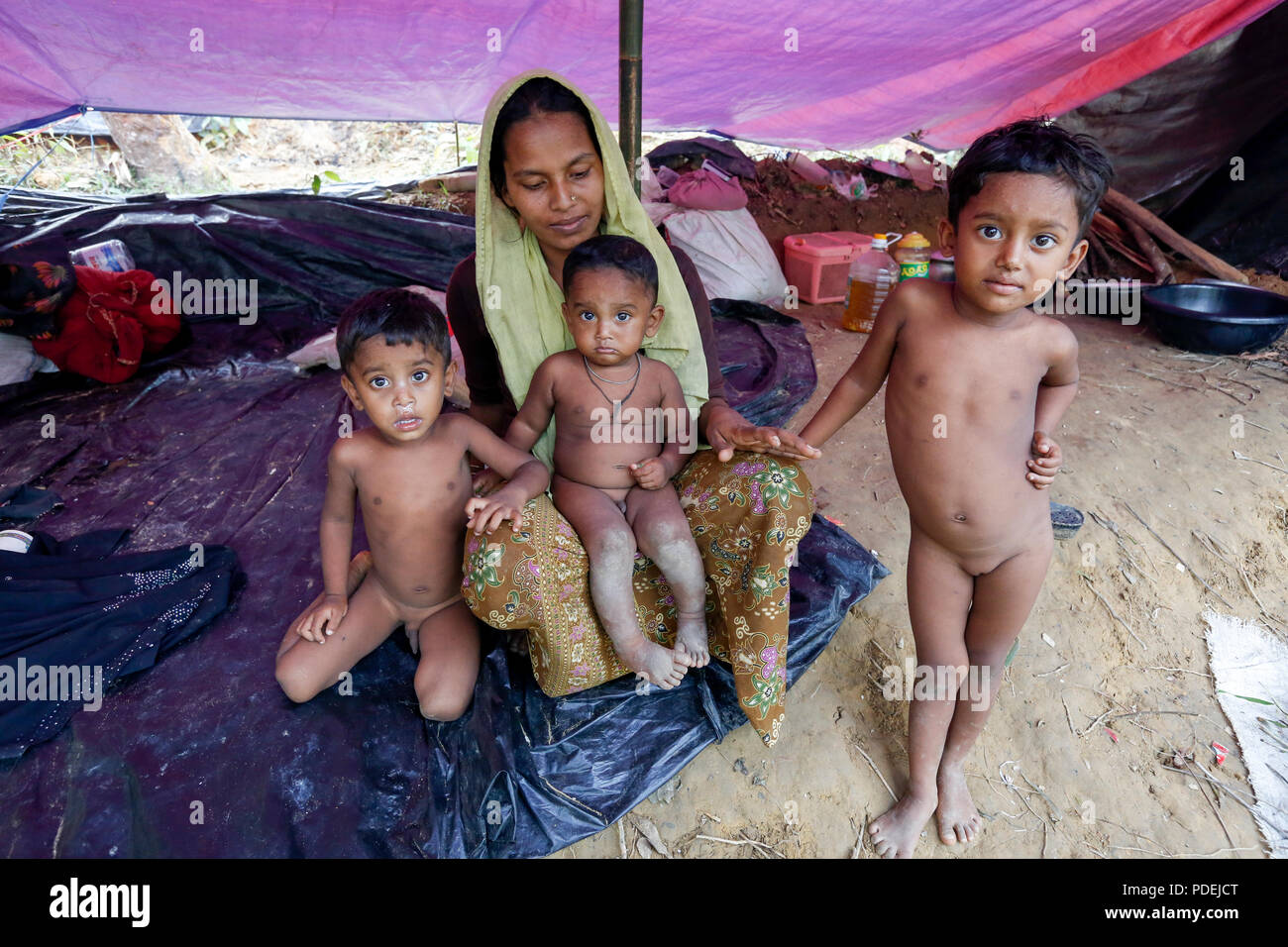 Newly arrived Rohingya refugees in their shelter at Kutupalong, Cox's Bazar, Bangladesh Stock Photo