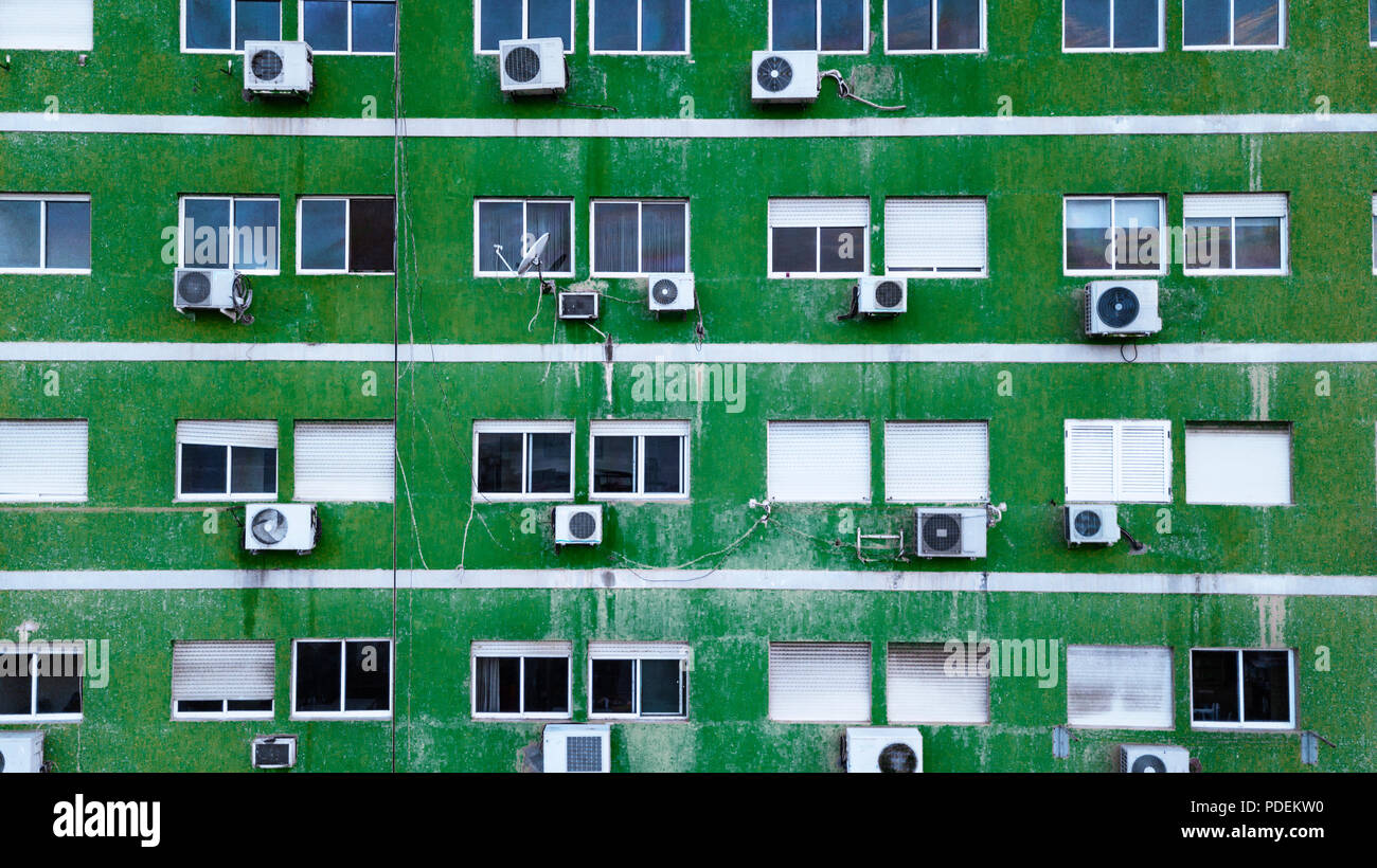 Facade of old green building with air conditioning boxes Stock Photo ...