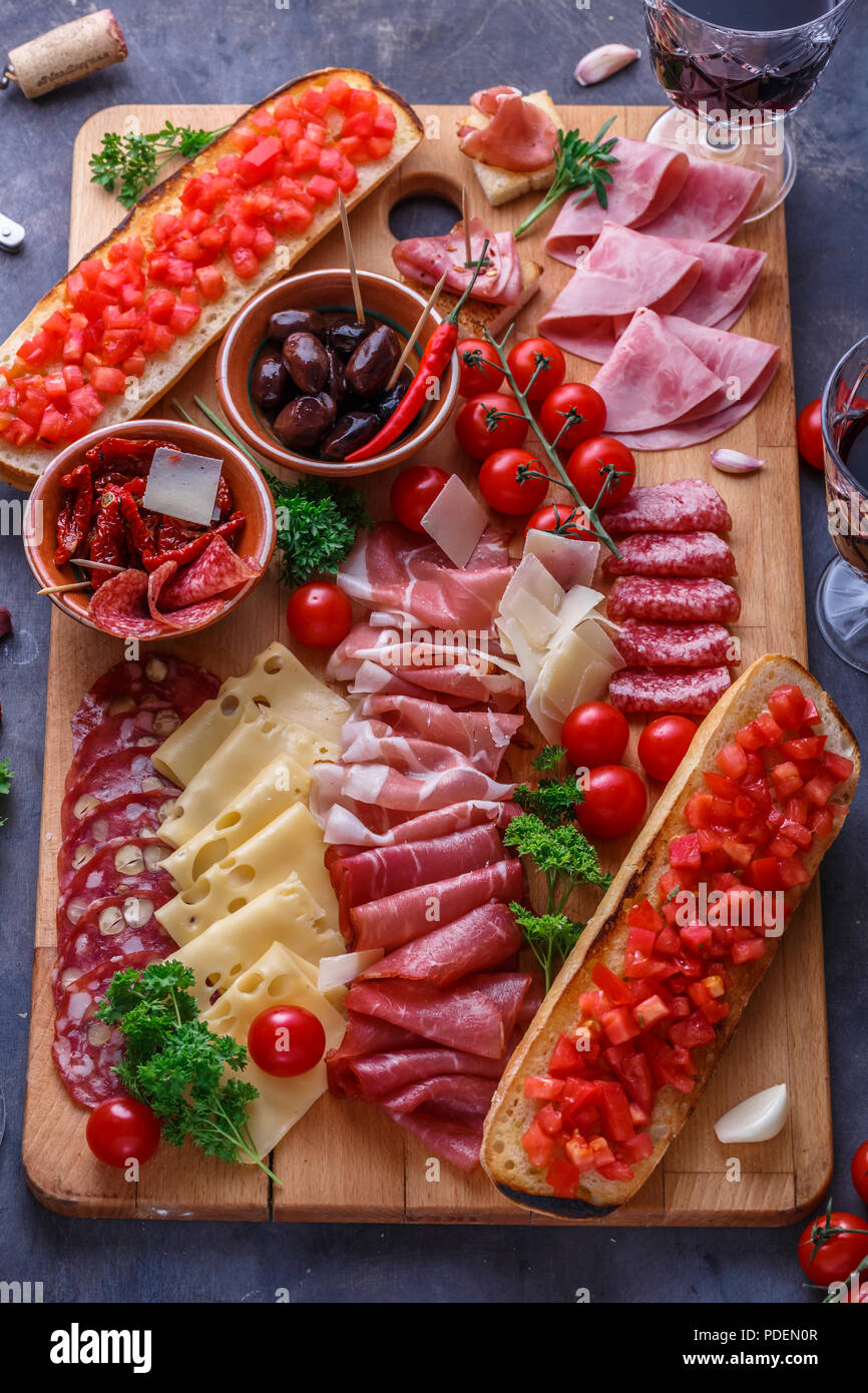 Board of cured meat, cheese and bread with wine Stock Photo Alamy