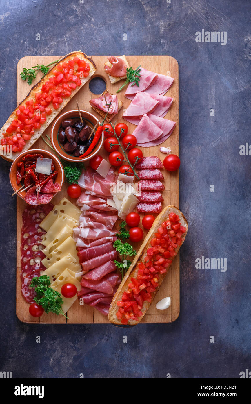 Salami, sliced ham, sausage, prosciutto, cheese, tomato. Meat antipasto