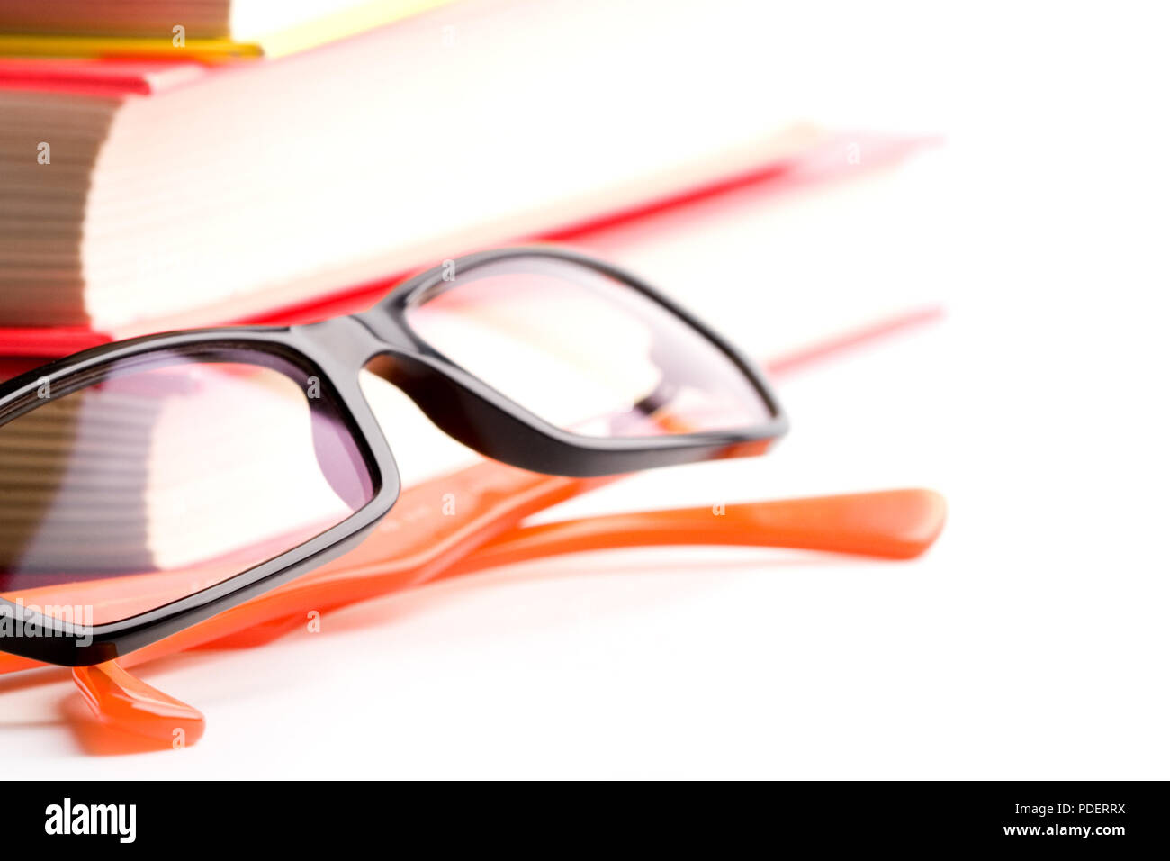 books and glasses closeup on white background Stock Photo - Alamy